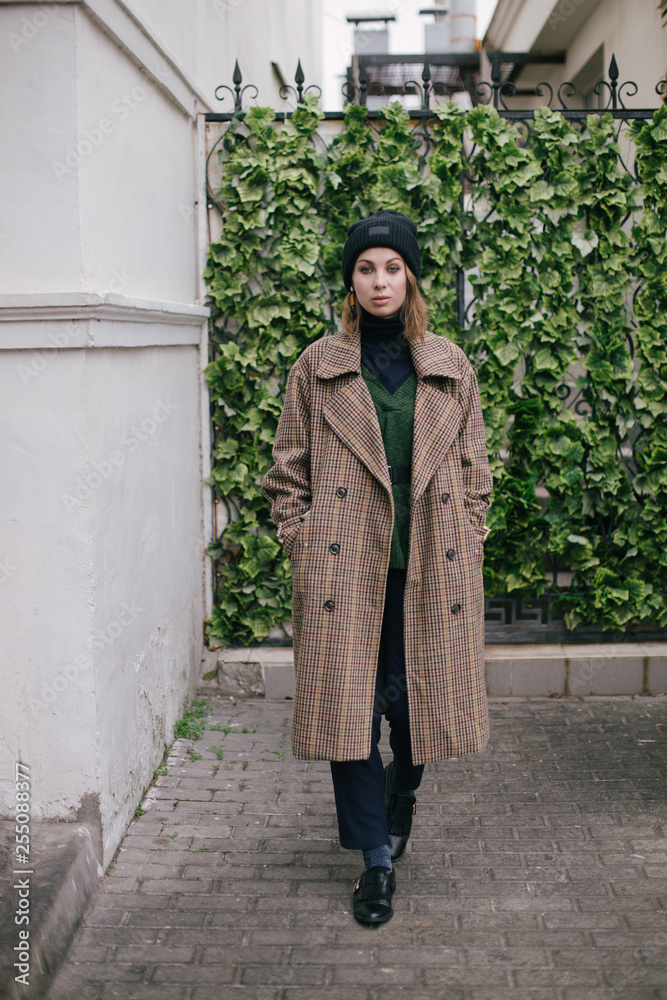 Young beautiful woman wearing fashion clothes posing on the street Young beautiful woman wearing fashion clothes posing on the street