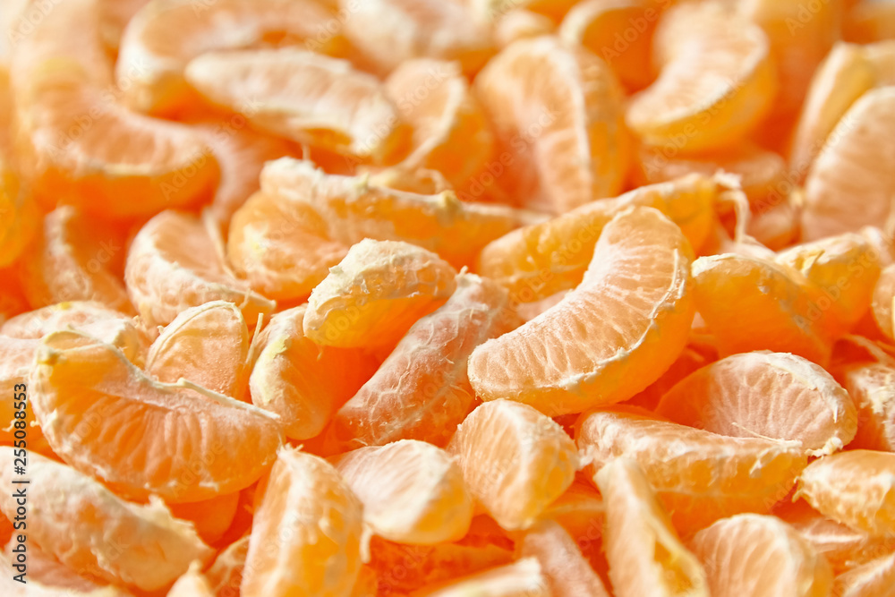 Peeled tangerine. Segments of mandarin fruit background Peeled tangerine. Segments of mandarin fruit background