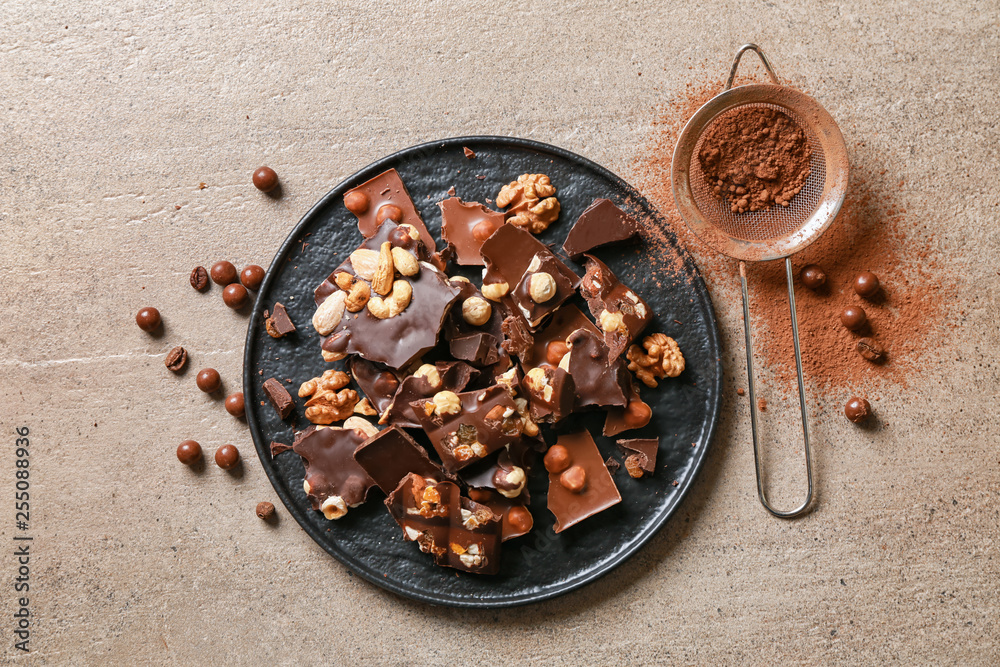 Sweet tasty chocolate with nuts on plate Sweet tasty chocolate with nuts on plate
