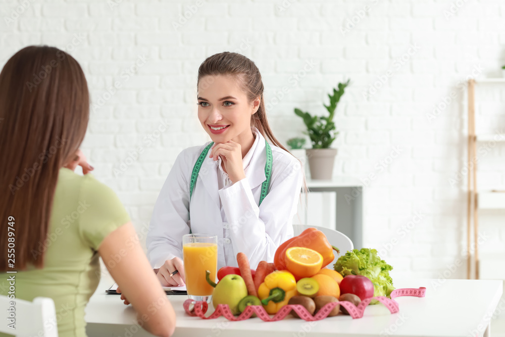 Young woman visiting nutritionist in weight loss clinic
