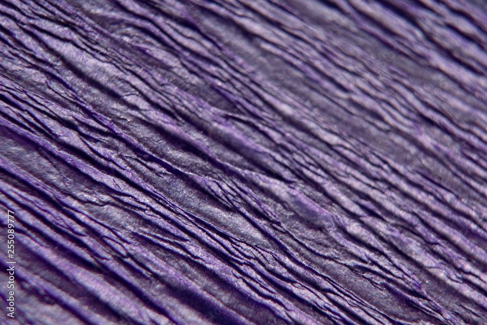 Wrinkled and crumpled blue paper as background or texture. Macro, close-up of paper. Wrinkled and crumpled blue paper as background or texture. Macro, close-up of paper.