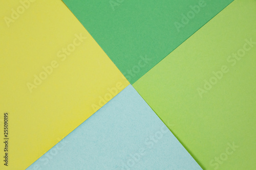 sheets of colored paper. Many colored sheets of paper are laid out in the harsh composition. background of colored paper.