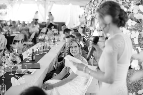 Canvastavla bride looking at maid of honor during wedding tast