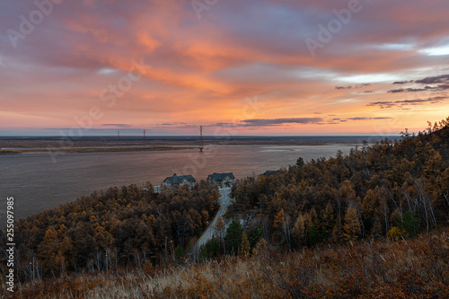 Dramatic heaven and magic reflection on the Lena river. Beautiful colorful natural sunset or sunrise over one of the greatest rivers Lena  Yakutia  Russia