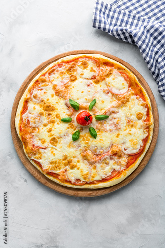 pizza, stone background gray color, top view, vertical shot, checkered napkin, restaurant menu, Italian cuisine