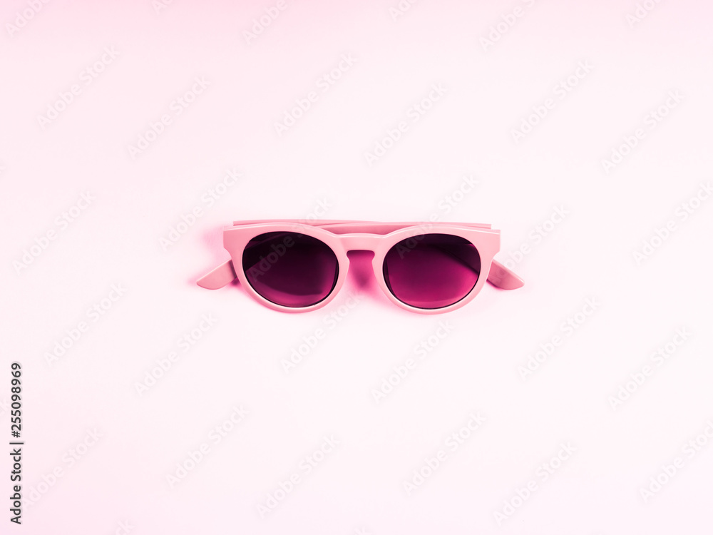 Pink sun glasses. Monochrome fashion flat lay Pink sun glasses. Monochrome fashion flat lay