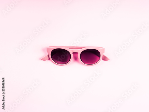 Pink sun glasses. Monochrome fashion flat lay