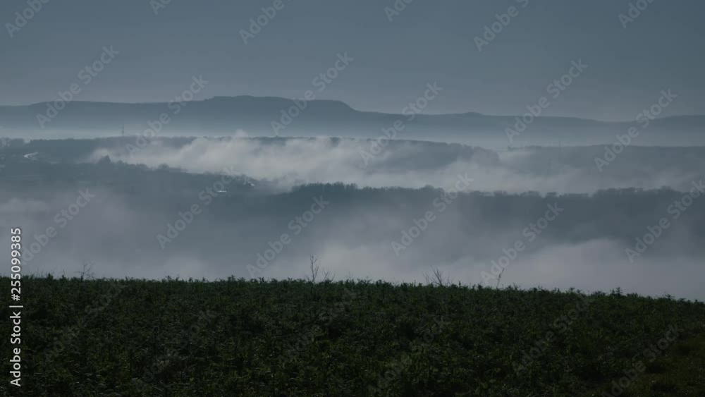 View from a hill on a foggy valley – Timelapse View from a hill on a foggy valley – Timelapse