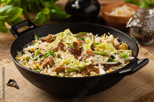 Fried veal, with rice, Chinese cabbage and mushrooms. Sprinkled with sesame and soy sauce.