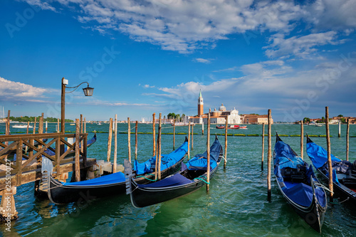 Gondolas and in lagoon of Venice by San Marco square. Venice, Italy