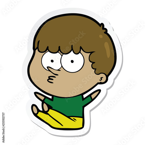 sticker of a cartoon boy sat waiting