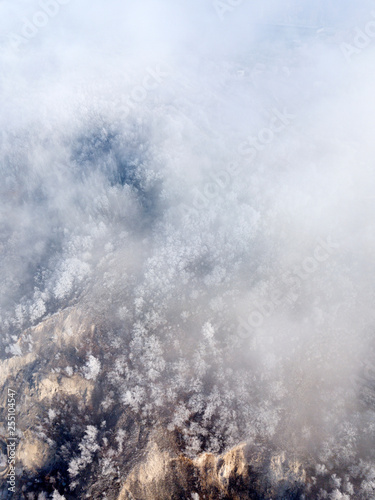 Aerial view of frost trees through the clouds, near Volga river, Samara, Russia.