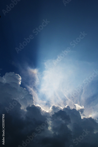 The sky with clouds and the sun. Thunderstorm dark clouds. Concept weather, time for change. Vertical format