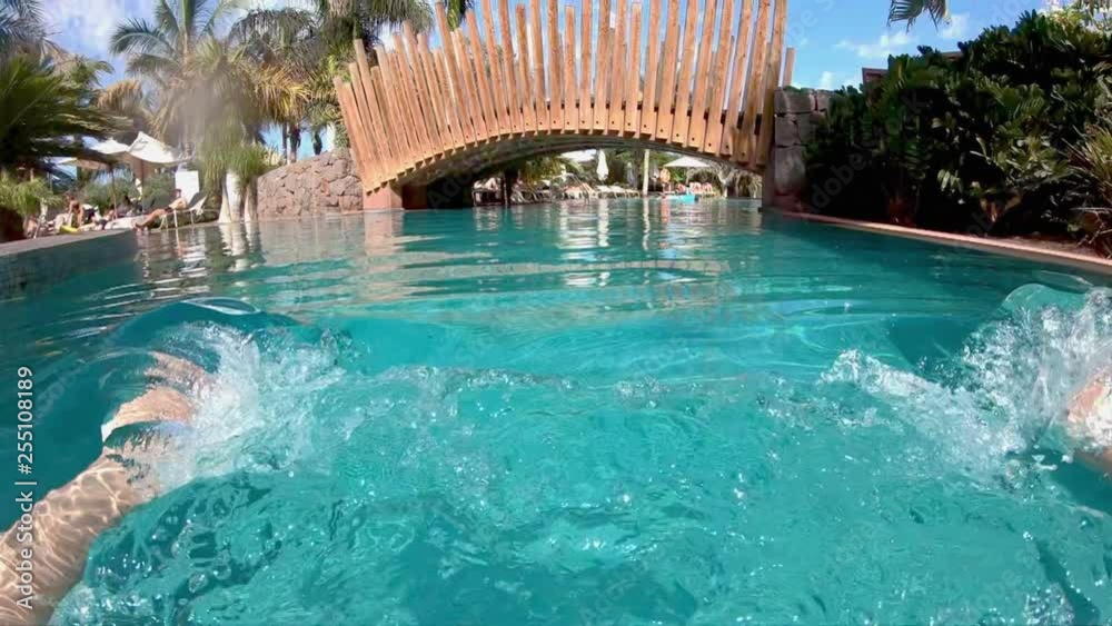 POV Man swimming in the poll with palm tree view in slow motion 250fps POV Man swimming in the poll with palm tree view in slow motion 250fps