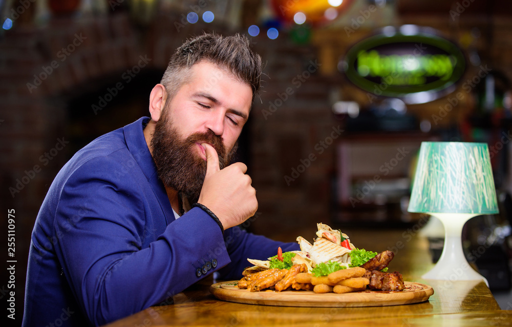 Businessman formal suit sit at restaurant. Man received meal with fried potato fish sticks meat. He deserve delicious meal. Enjoy your meal. High calorie snack. Delicious food. Relax after hard day