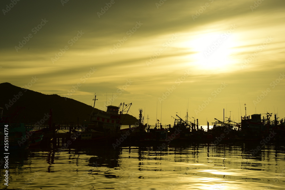 Fishing port view before sunset With beautiful golden yellow sky