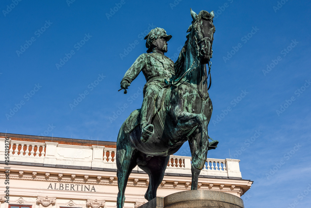 Obraz premium Austria, Vienna, Albrechtsplatz: Front view of world famous Albertina museum palais palace with Albrecht statue in the city center of the Austrian capital with blue sky - concept travel history art