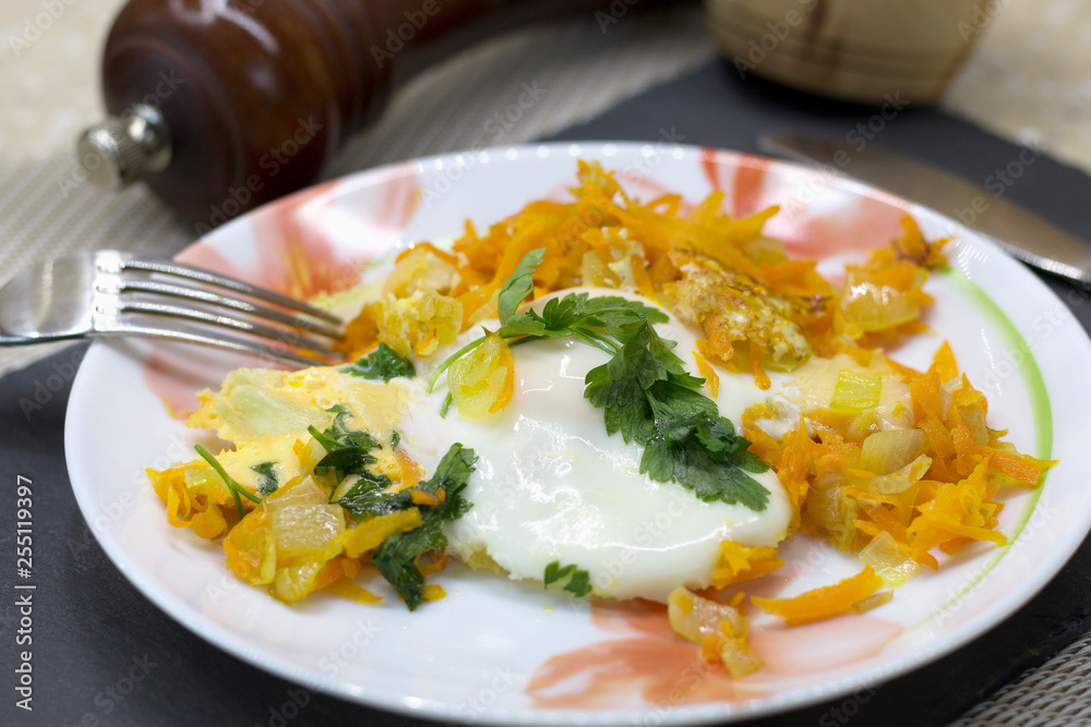 Home breakfast of fried eggs, vegetables, cheese and parsley Home breakfast of fried eggs, vegetables, cheese and parsley