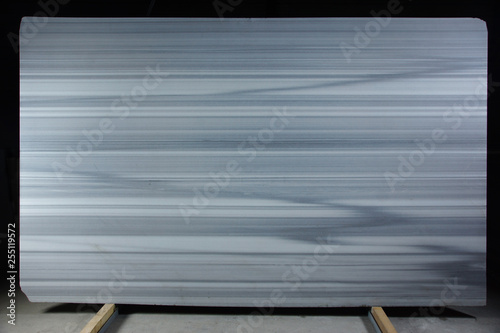 White natural marble with gray parallel stripes resembling a zebra is called Zebrino.