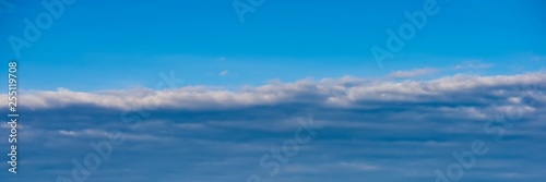 Fototapeta Naklejka Na Ścianę i Meble -  white clouds against the blue sky on a sunny day.