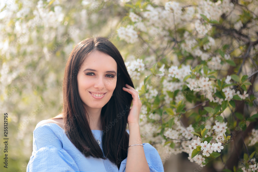 Outdoors Portrait of a Spring Woman Enjoying Blooming Season Outdoors Portrait of a Spring Woman Enjoying Blooming Season