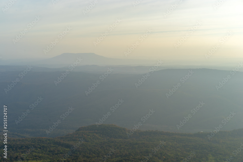 Mountain range with visible silhouettes through the morning and evening.