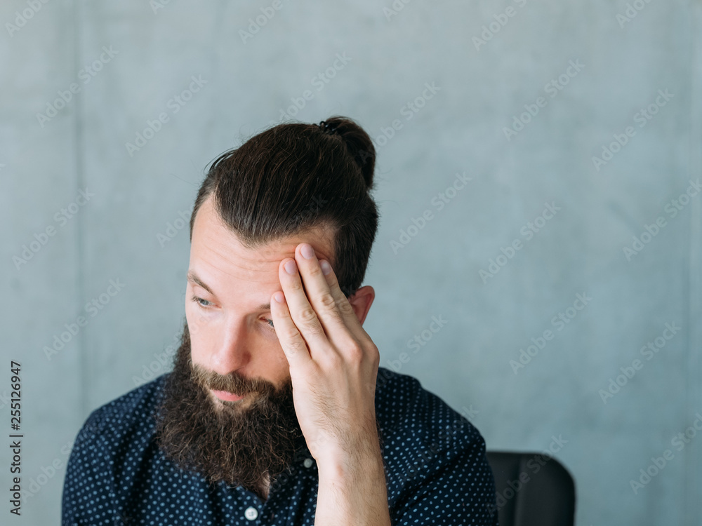 Job interview failure. Upset unemployed young man thinking hard. Copy space for text. Job interview failure. Upset unemployed young man thinking hard. Copy space for text.