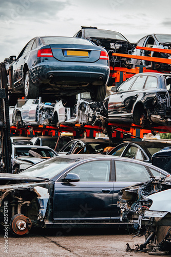 Damaged cars waiting in a scrapyard to be recycled or used for spare parts