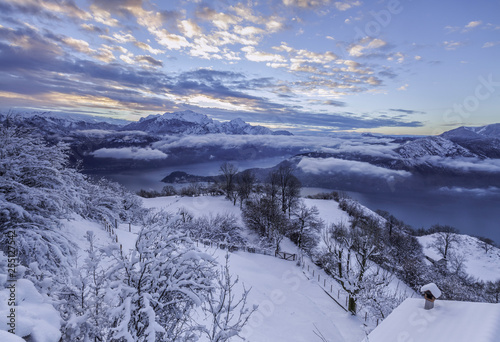 Fozen morning in Nava pasture over Tremezzina in Lake Como district, in background Bellagio and Grigna peak,Italy,Europe photo