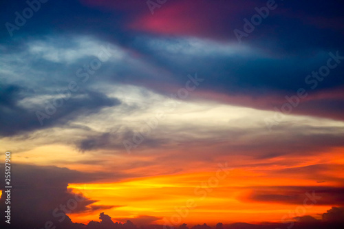 multicolor flame cloud sunset boat on sea and sky