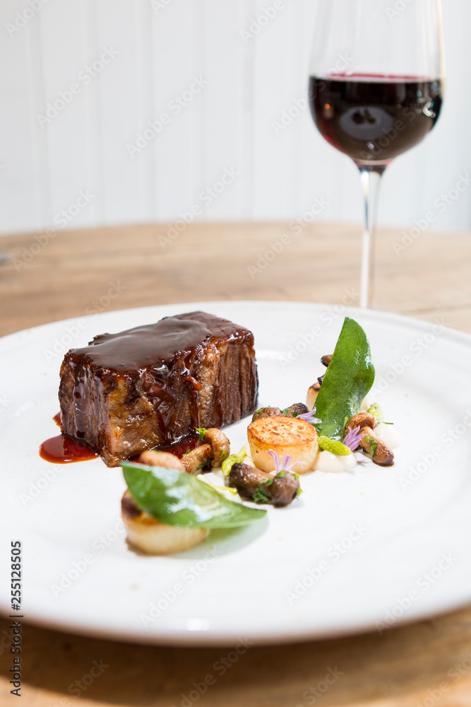 Beef brisket with mushrooms, sage and a glass of red wine Beef brisket with mushrooms, sage and a glass of red wine