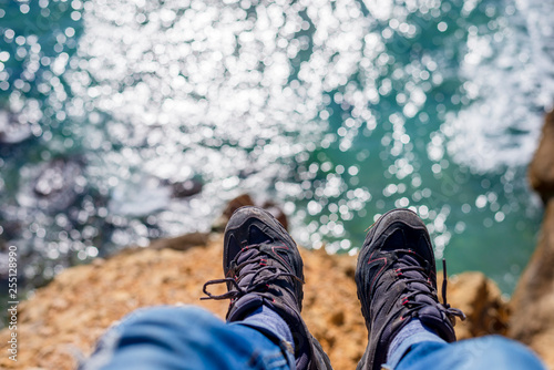 Above view of a man legs over the sea.