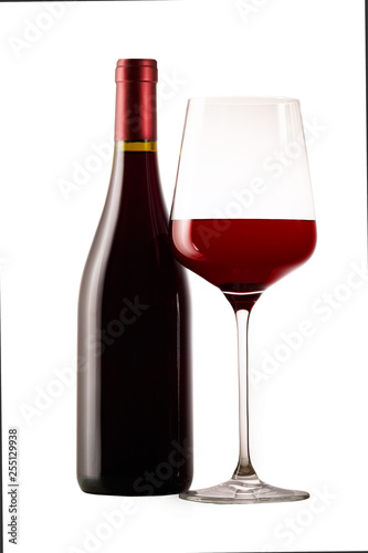 Red wine in a glass and a bottle. Isolated white background.