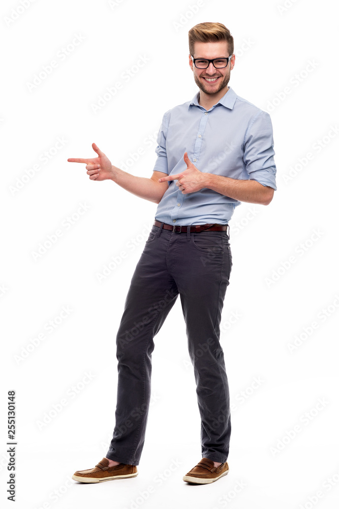 Full length portrait of young man pointing Full length portrait of young man pointing