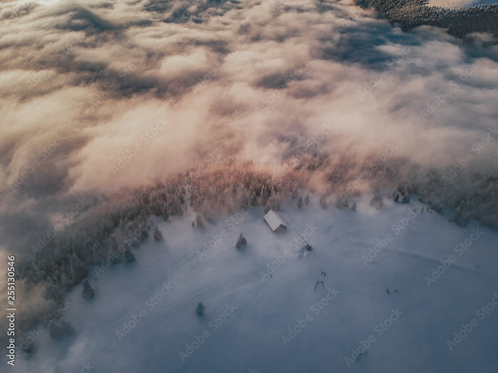 Aerial view of a sunset above the cloud
