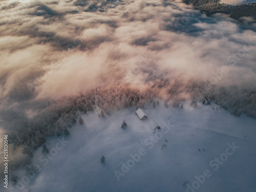 Aerial view of a sunset above the cloud