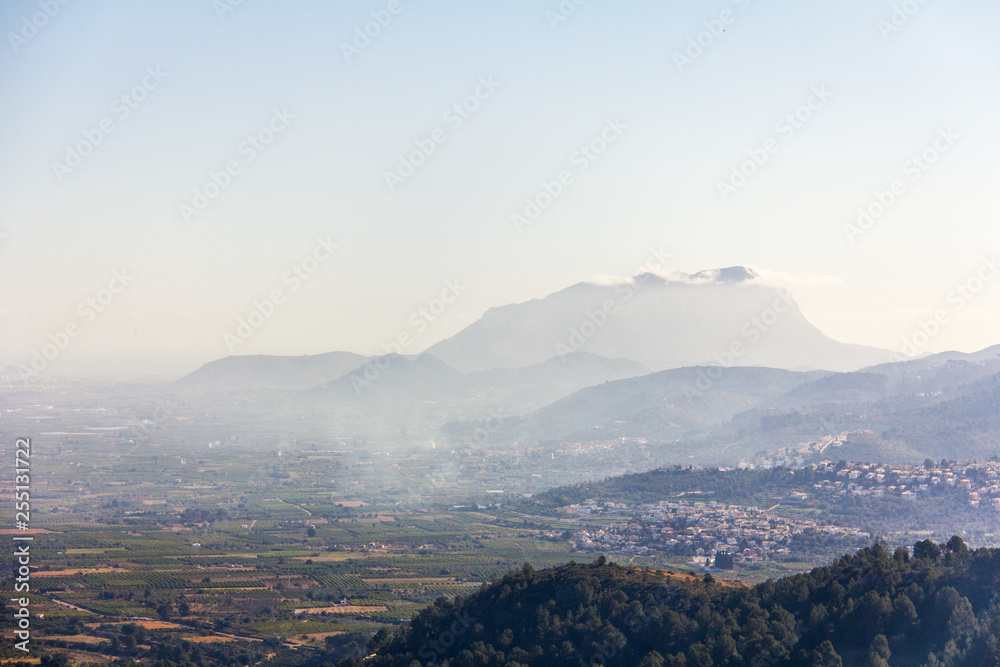 Panoramic view of Montgó mountain and Rectoria Valley in Marina Alta, Alicante, Spain. View from Vall de Laguar town. Panoramic view of Montgó mountain and Rectoria Valley in Marina Alta, Alicante, Spain. View from Vall de Laguar town.