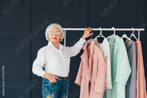 Smart senior lady wardrobe. Shopping leisure. Personal style of wealthy elderly woman. photo