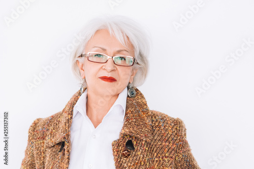 Senior lady portrait. Confidence and elegance. Tweed fashion trends. Aged woman looking at camera. Copy space. photo