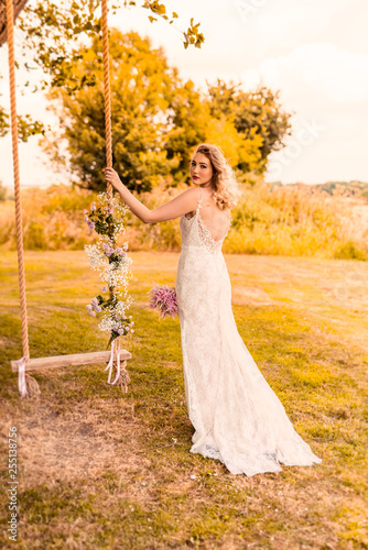 Plum on floral wedding swing © harry