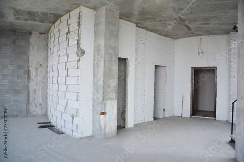 Interior hall room under construction, metal door lintels. Wall without plasterwork and ready to remodel © bildlove