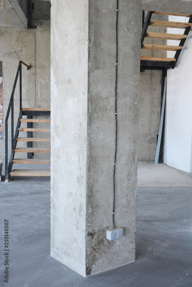 House concrete column with wire and outlet plug. House concrete column with wire and outlet plug.