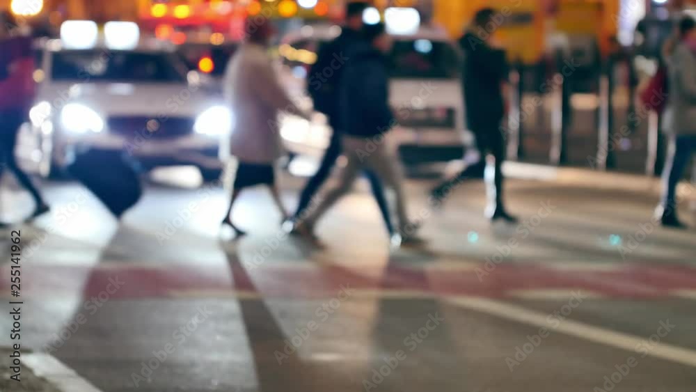Unrecognizable people on the sidewalk. Evening n Warsaw. Unrecognizable people on the sidewalk. Evening n Warsaw.