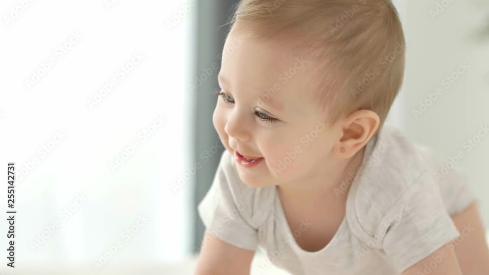 Close up of crawling baby on the floor Close up of crawling baby on the floor