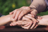 Caring for old people: Granddaughter's hands and grandmother's hands