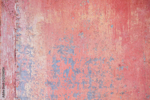 Detail of old red metallic wall background or texture
