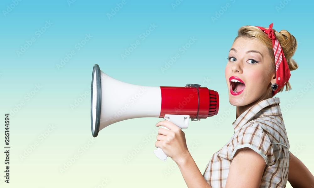 Portrait of woman holding megaphone, dressed in Portrait of woman holding megaphone, dressed in