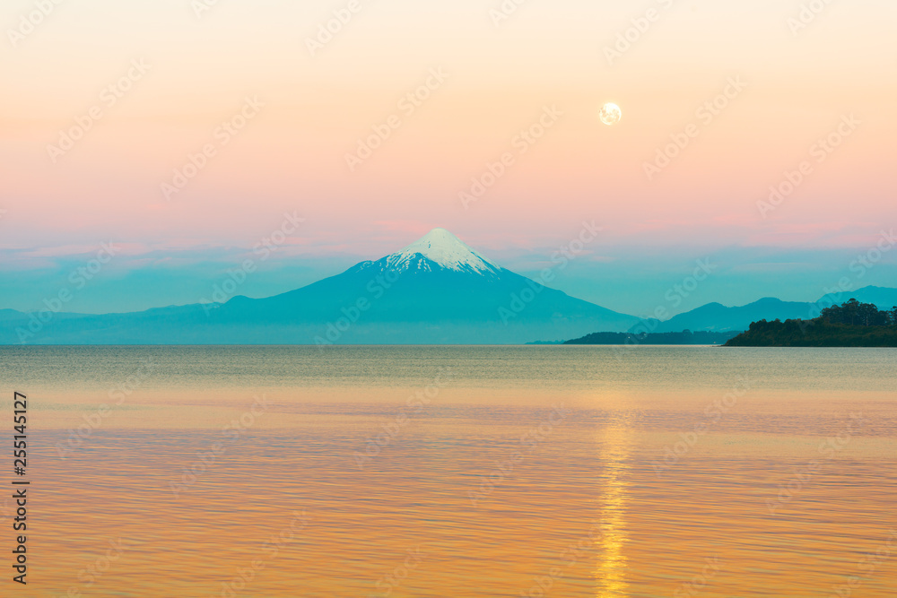 Moon rising over Lake LLanquihue and Osorno Volcano, X Region de Los Lagos, Chile
