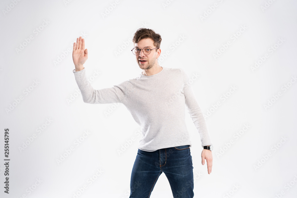 Happy smiling young man presenting and showing your text or product isolated on white background. Happy smiling young man presenting and showing your text or product isolated on white background.