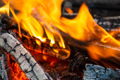 Burning firewood. Fire, flames, charred wood